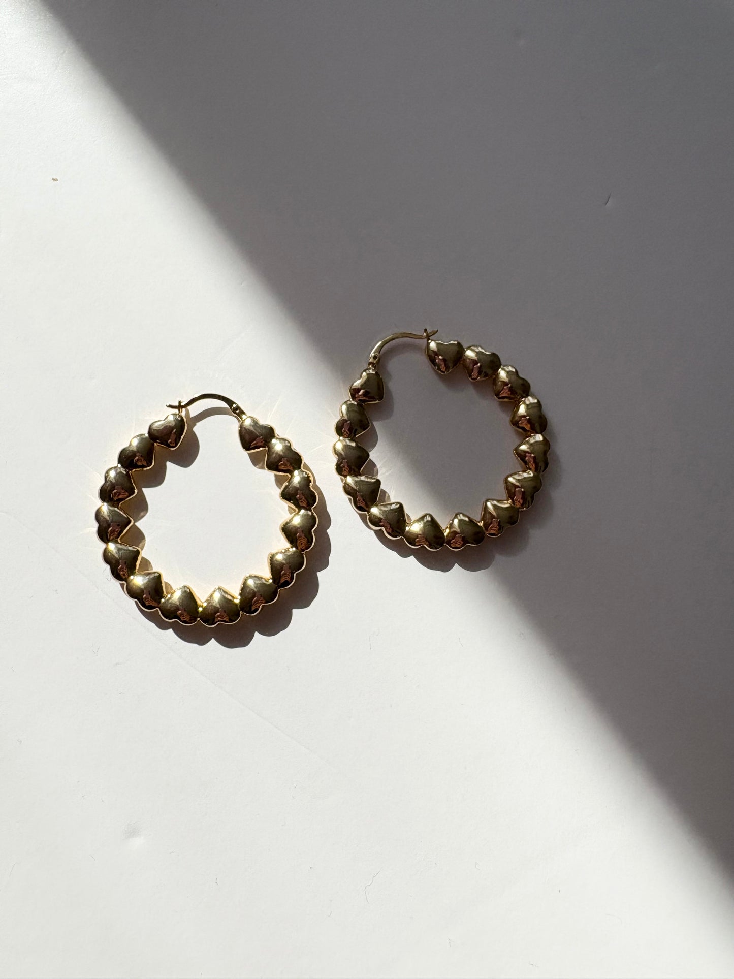 Noir NYC gold plated heart hoops