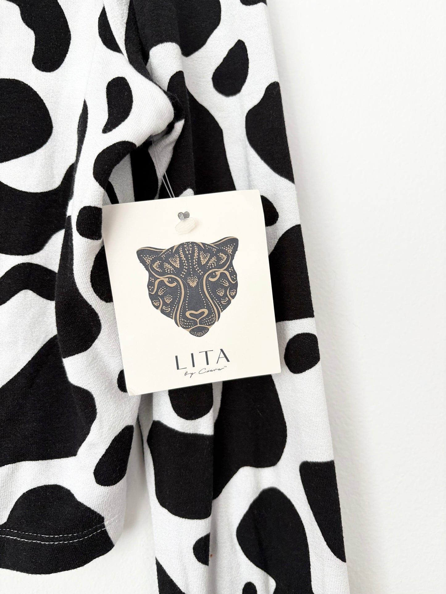 Lita by Ciara cow print mockneck top Medium