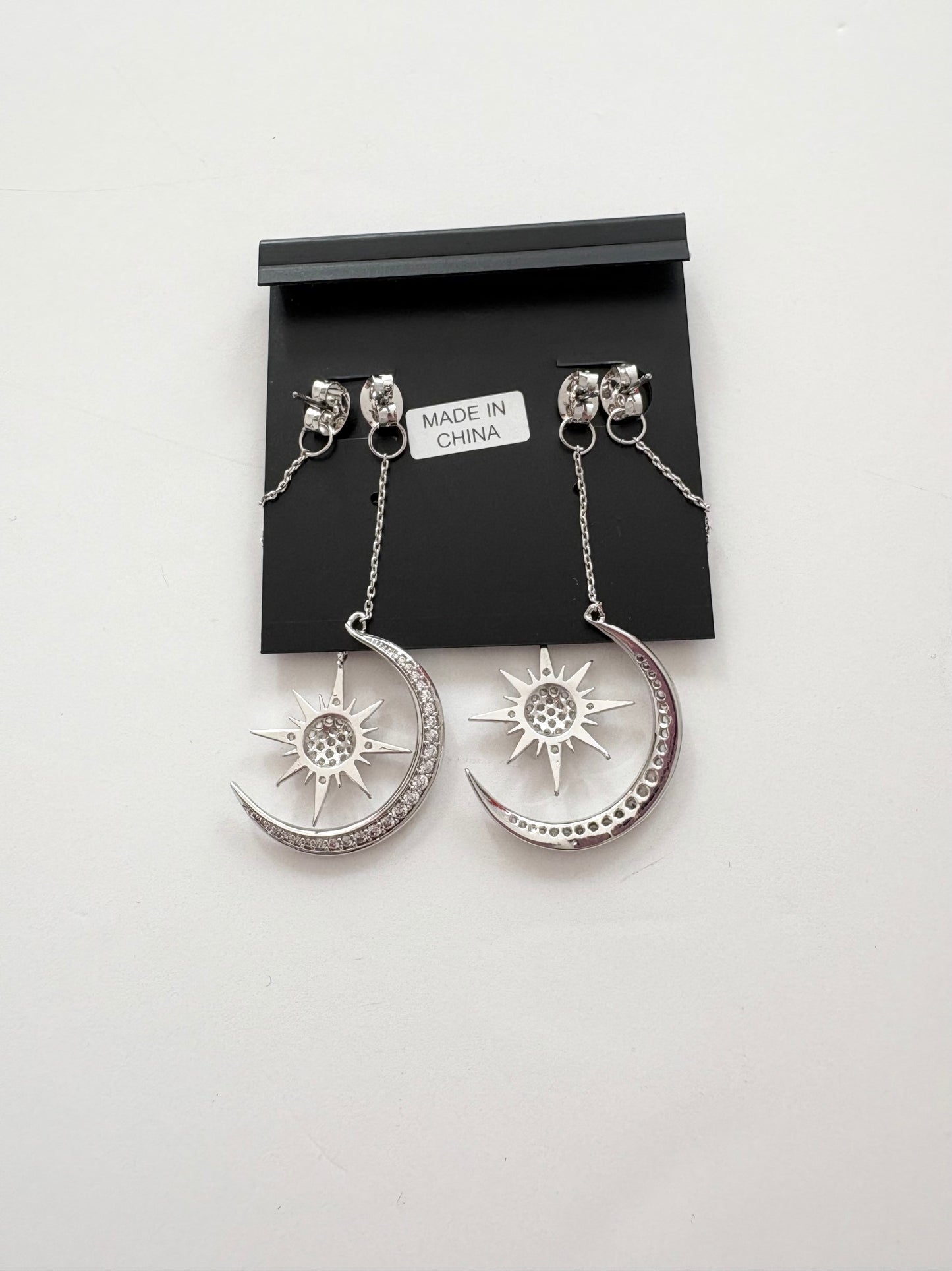 Noir NYC Star & Moon double swinger earrings