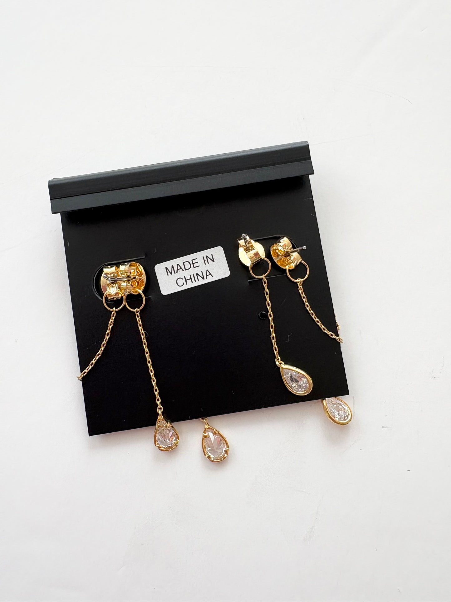 Noir NYC gold plated teardrop double swinger earrings