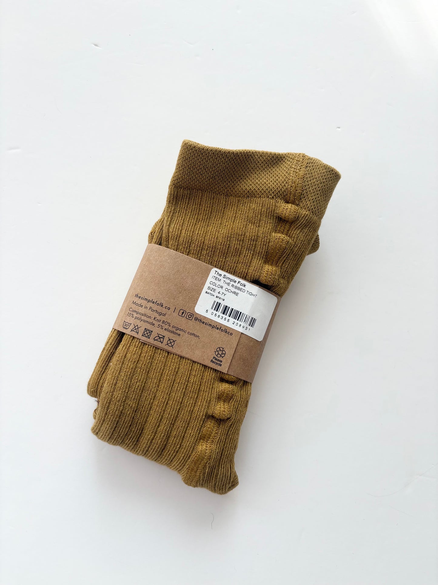 The simple folk ribbed tights in ochre 4/7Y