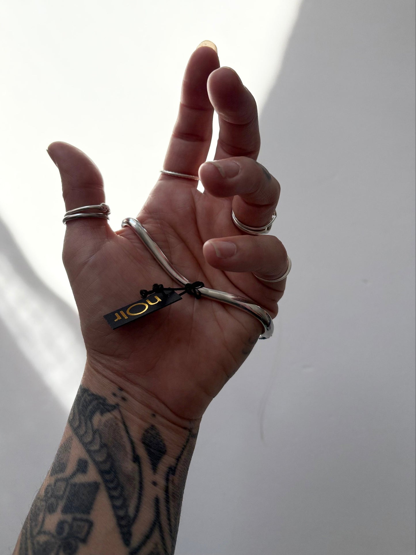 Noir NYC red eyes snake palm cuff
