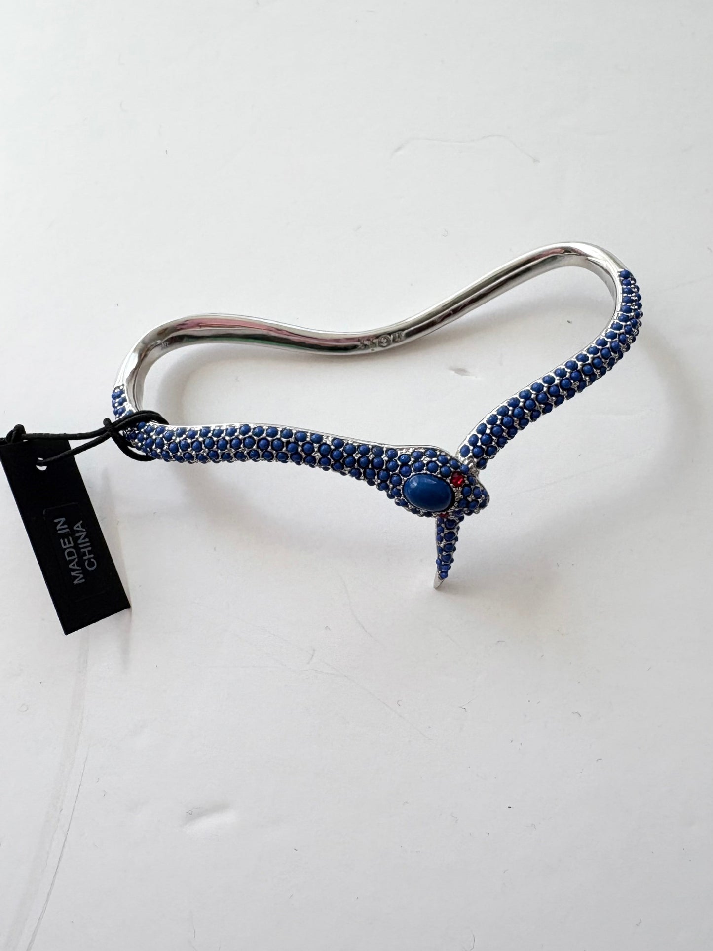 Noir NYC red eyes snake palm cuff