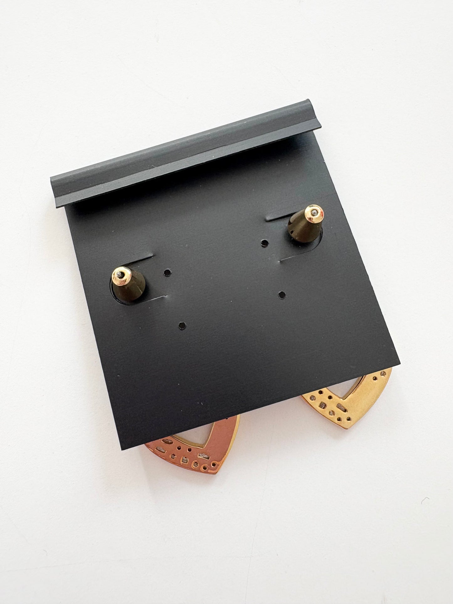 Noir NYC gold heart pendant earrings