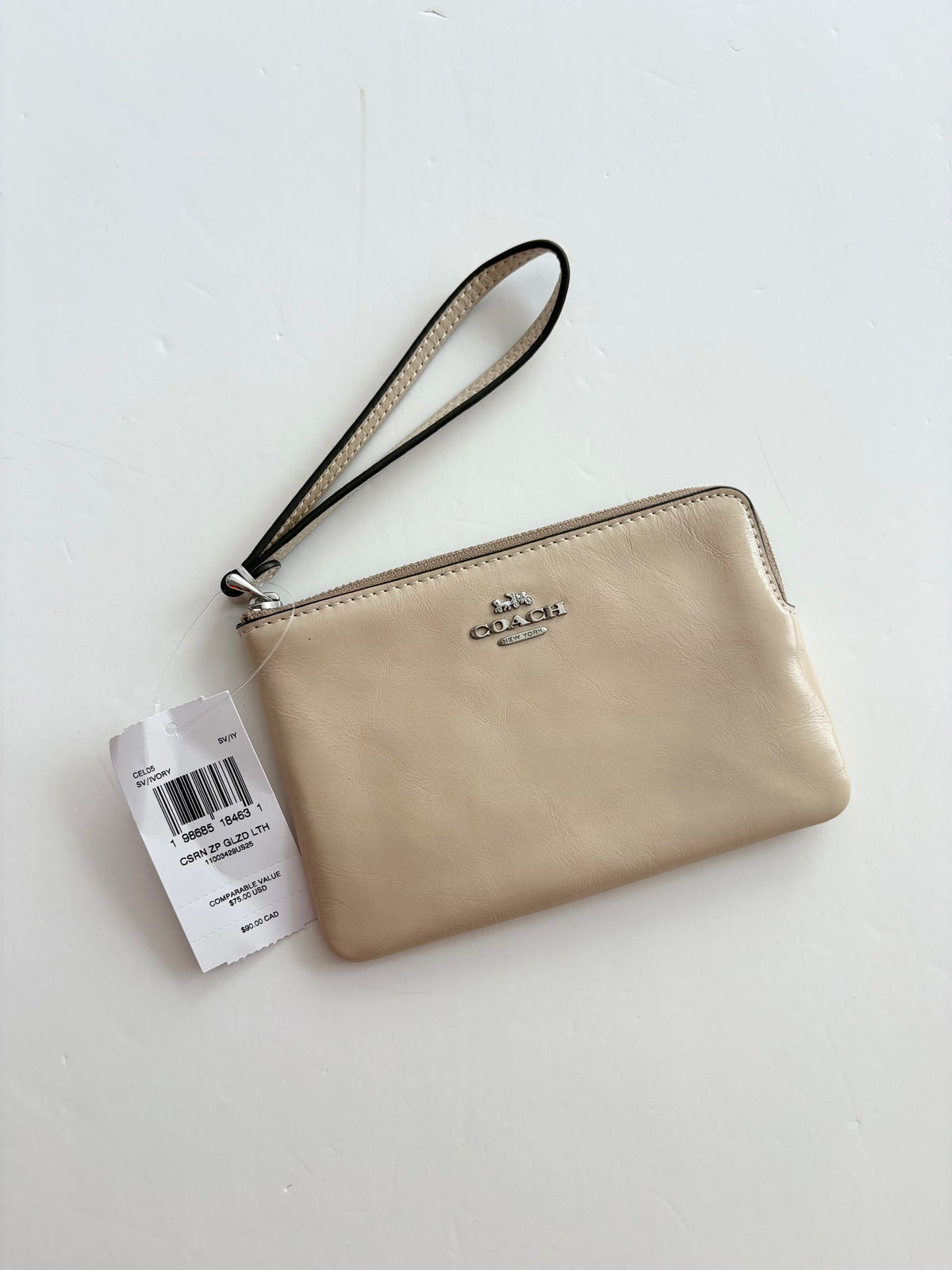 Portefeuille a poignet et zip Coach