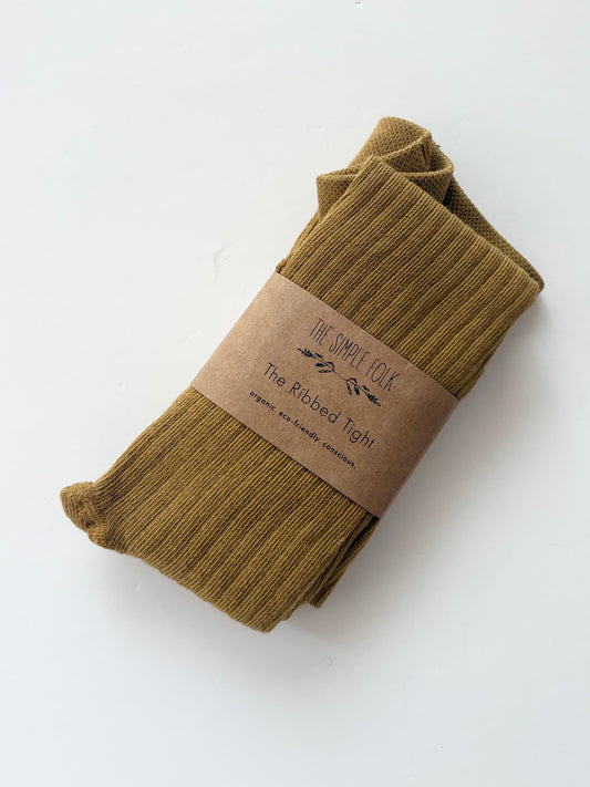 The simple folk ribbed tights in ochre 4/7Y