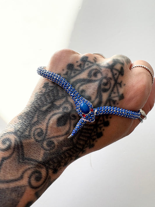 Noir NYC red eyes snake palm cuff