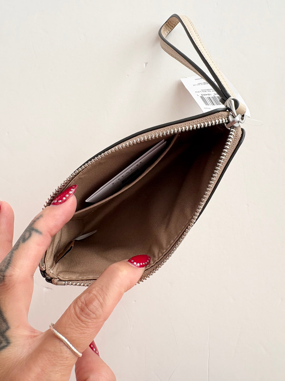 Portefeuille a poignet et zip Coach